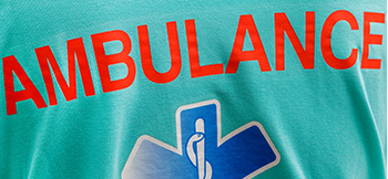 A close-up shot of an ambulance logo on a piece of clothing