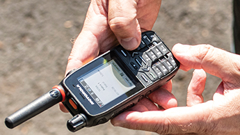 A close-up of a Motorola Solutions MXP600 radio being used