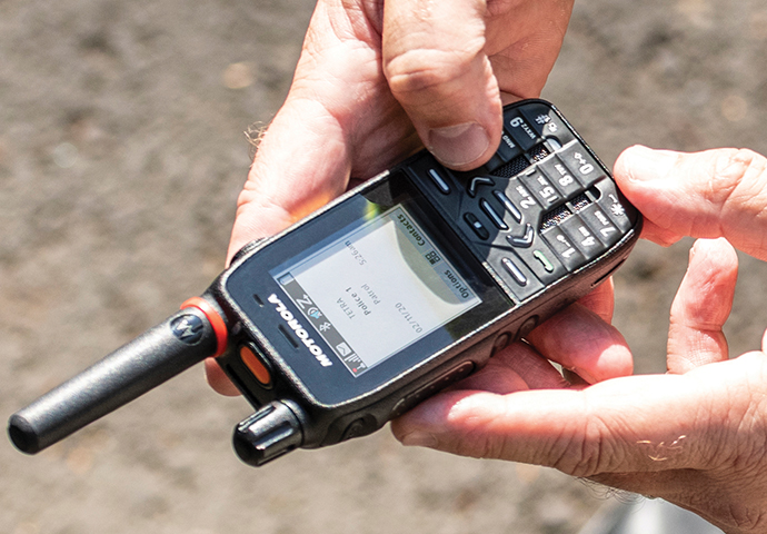 A close-up of a Motorola Solutions MXP600 radio being used