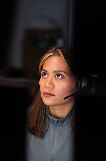 Woman looking at desktops