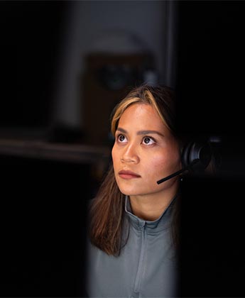 Woman looking at desktops