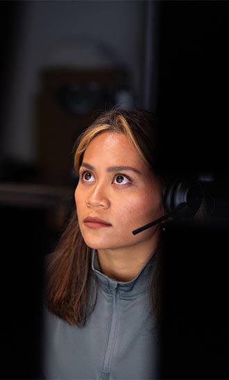 Woman looking at desktops