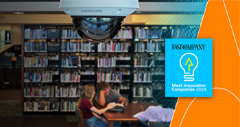 Avigilon security camera in a library with an award overlay