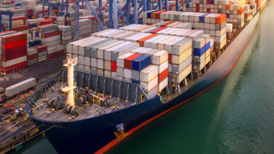 Shipping containers at busy port terminal