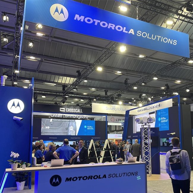 Motorola Solutions team gathers at event booth