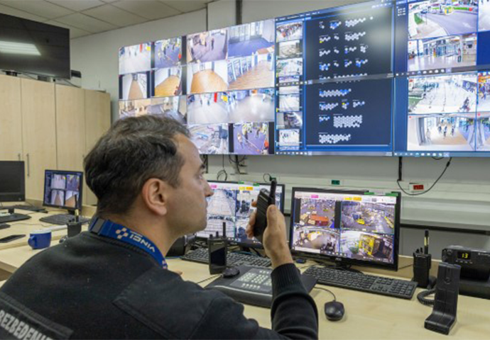 A Belgrade airport employee uses the video security system