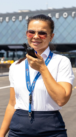 A Belgrade airport employee uses a radio