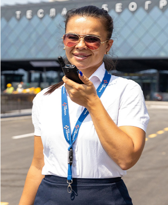 A Belgrade airport employee uses a radio