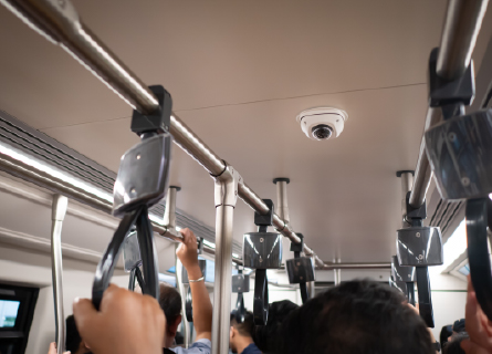 Dome camera overlooking crowded train car