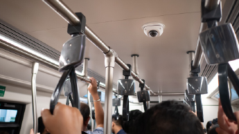 Dome camera overlooking crowded train car