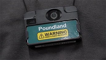 Retail employee wearing body worn camera