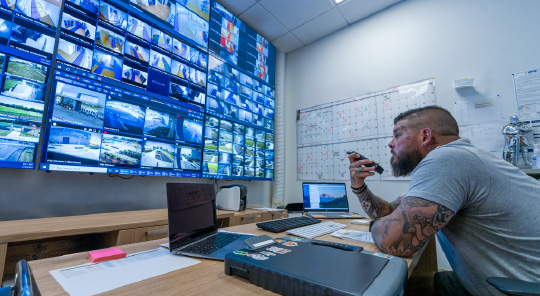 Personnel observes the video security screens at Greater Dayton School  