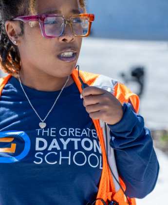A member of staff at Greater Dayton School uses a Motorola Solutions radio