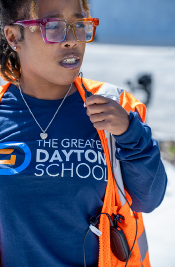 A member of staff at Greater Dayton School uses a Motorola Solutions radio