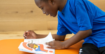 A student at Greater Dayton school reads a book