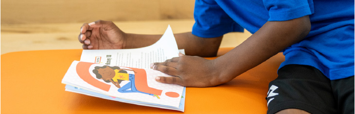 A student at Greater Dayton school reads a book