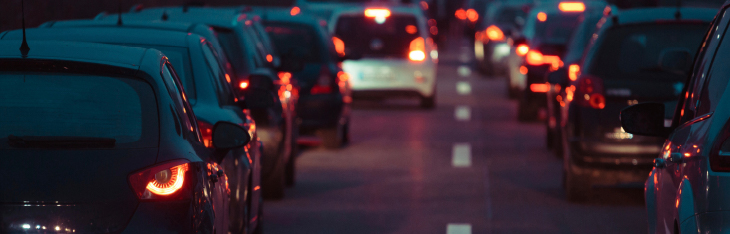 A line of cars at night caught in a traffic