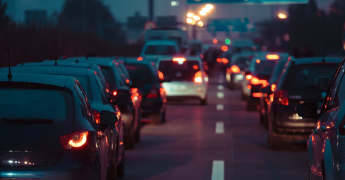 A line of cars at night caught in a traffic