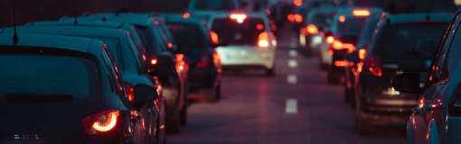 A line of cars at night caught in a traffic