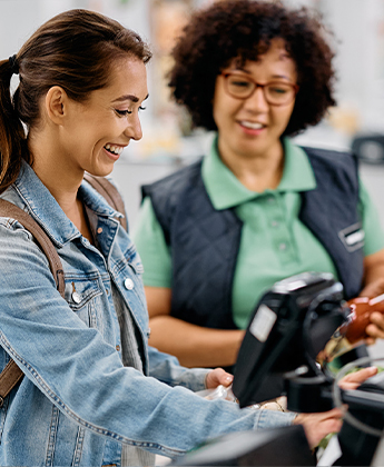 Shopper paying at checkout