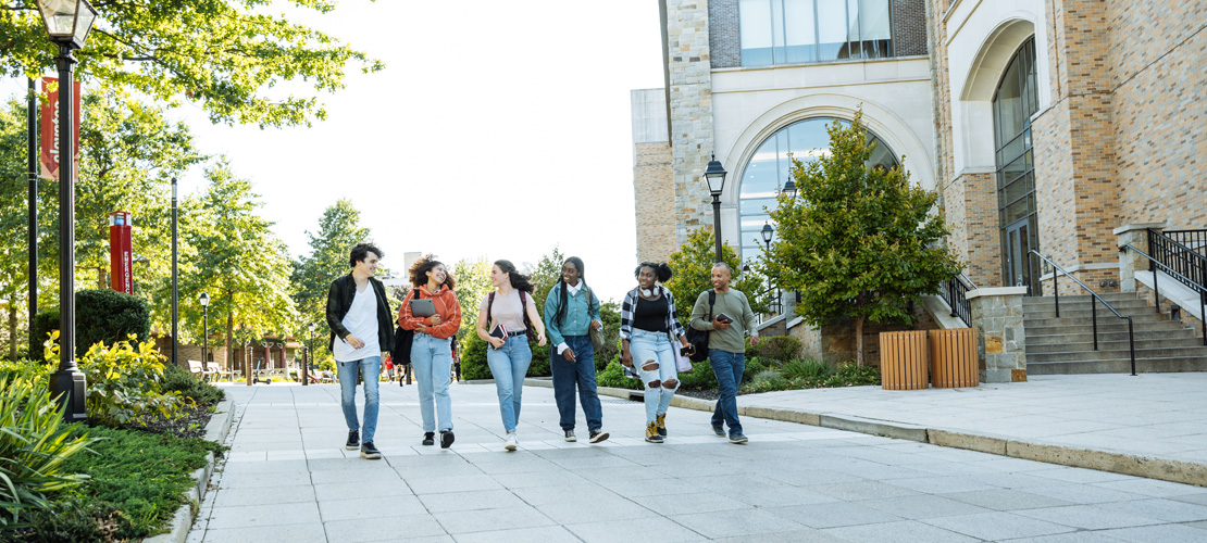 Group of students walking on campus