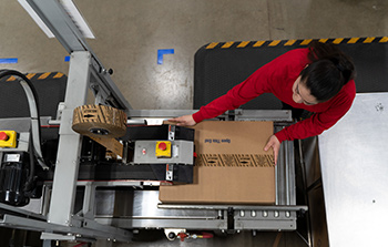 Image: Woman in factory on assembly line