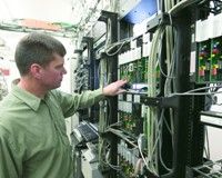 Image of a tech working on equipment