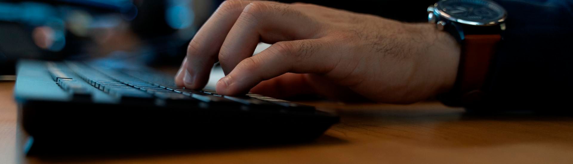 Image of hands on a keyboard