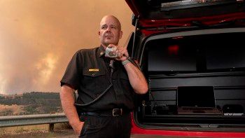 Image of a fire chief talking on his radio
