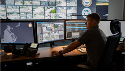 Crime analyst working in a command center