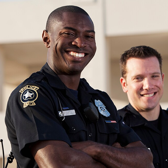 Police officers looking at camera smiling