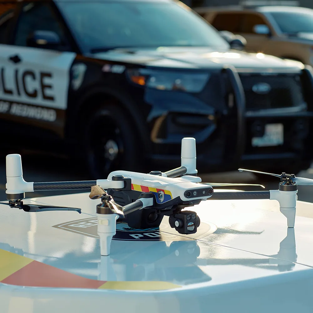 A drone on a police car.
