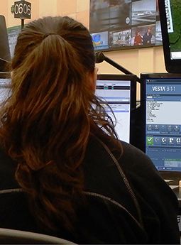 911 call taker at computer