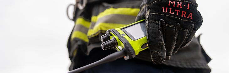 Firefighter standing in front of fire truck