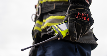 Firefighter standing in front of fire truck