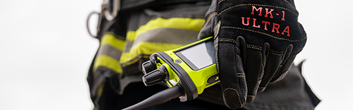Firefighter standing in front of fire truck