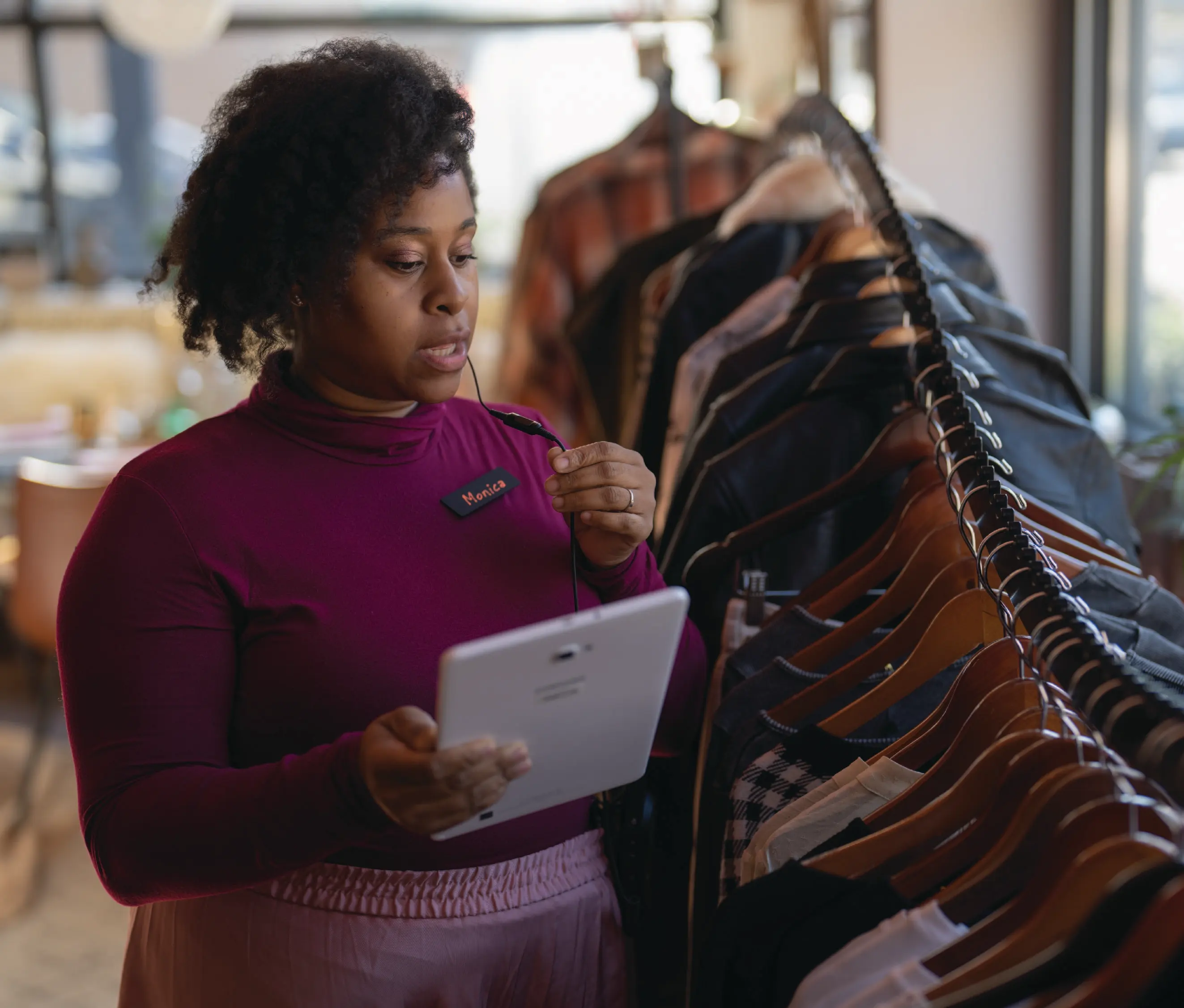 Retail worker using tablet in store