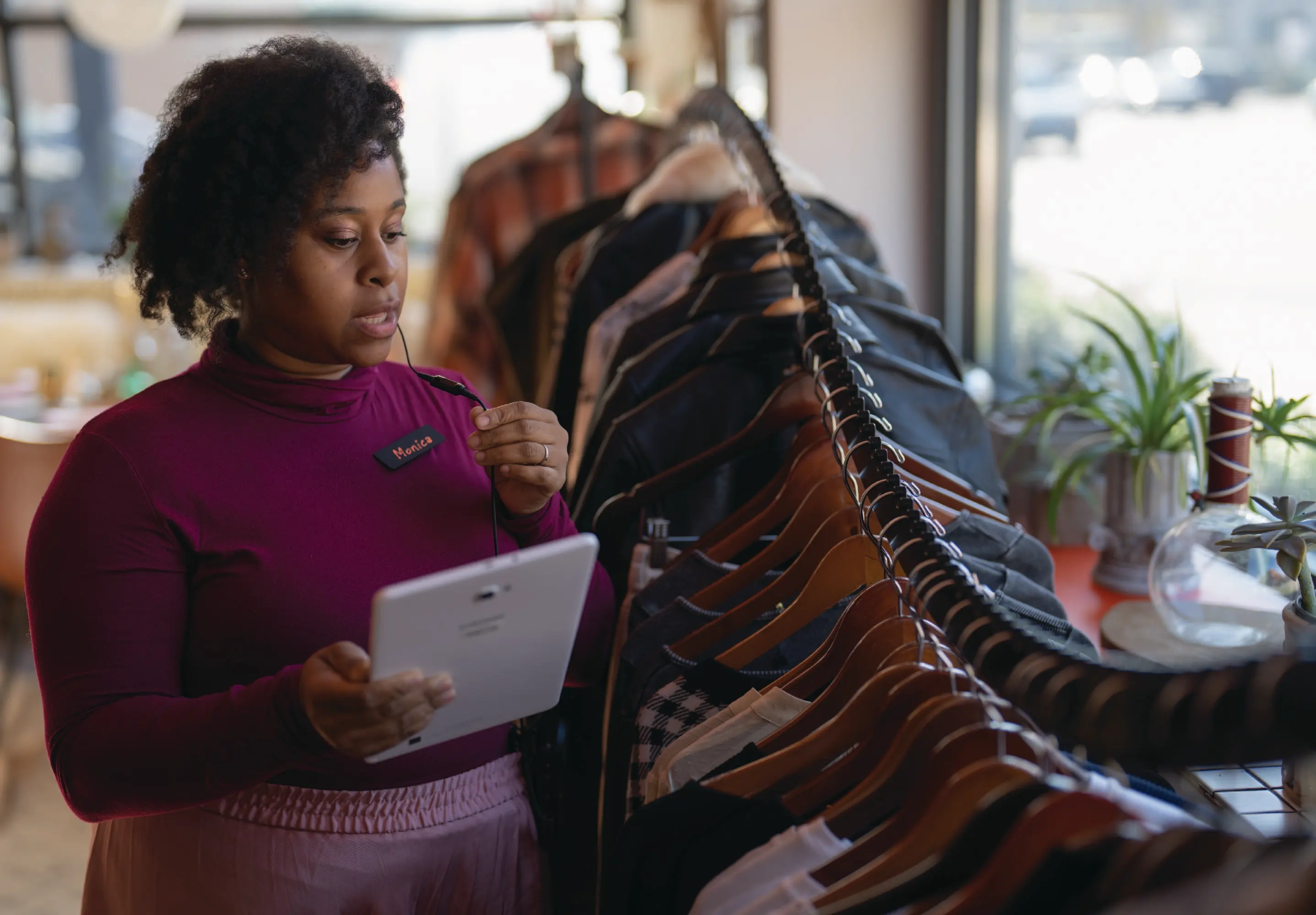 Retail worker using tablet in store