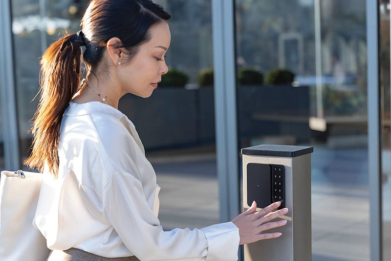Woman accessing building using access control point