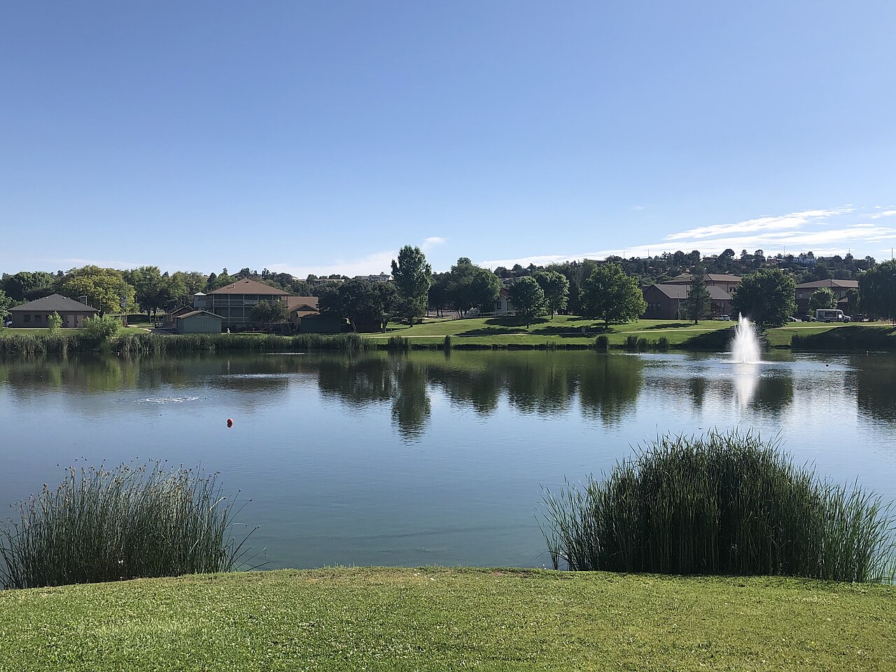 A lake with houses - photographed by Richard N Horne