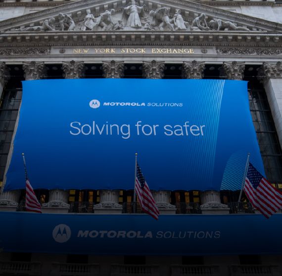 New York Stock Exchange with Motorola Solutions flag on the front